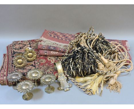 An Arts and Crafts textile wall hanging, a Regency Prince of Wales style brass tie back 'Ich Dien' to top, a set of six brass