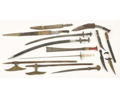 Swords and daggers, including two talwars, one in a scabbard, two axes, a Japanese sword, and nine further daggers and knives