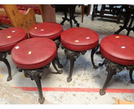 FIVE CAST METAL CIRCULAR CUSHION TOP STOOLS