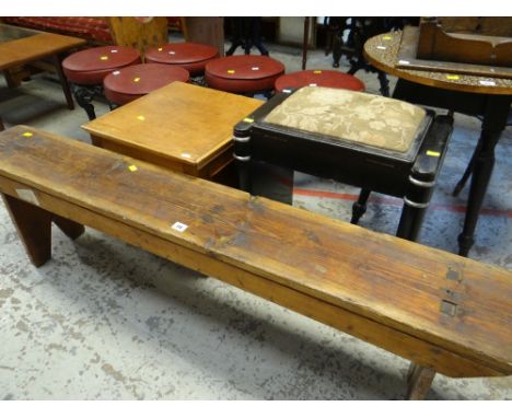 RUSTIC PINE MORTISE LEG BENCH, together with a pine commode and vintage piano stool