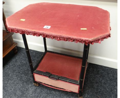 UNUSUAL VINTAGE BAMBOO-EFFECT WORKTABLE having box base on castors and upholstery covered, 55cms wide