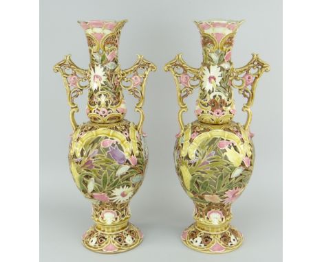 PAIR OF ZSOLNAY PECS PORCELAIN TWIN-HANDLED VASES of baluster form, spreading circular base, waisted neck, all round open-wor