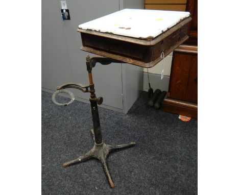 DENTIST'S BRACKET TABLE four-spoked cast iron base, white enamel top, four small drawers Provenance: vendor's late husband wa