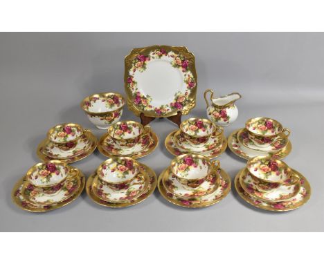 An Early 20th Century Rose and Gilt Tea Set to comprise Eight Cups and Saucers, Nine Side Plates, Cake Plate Slop Bowl and a 