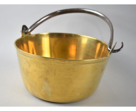 A Vintage Polished Brass Jam Kettle with Iron Loop Handle, 23cms Diameter 