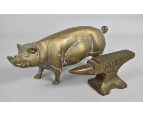 A Vintage Metal Desk Top Advertising Paperweight together with a Heavy Brass Model of a Pig, 20cms Long 