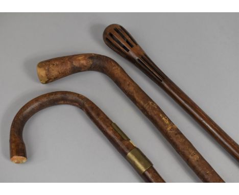 A Vintage Wooden Puzzle Ball Stick, two Other Walking Sticks 