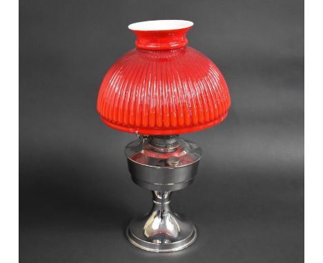 A Ind 20th Century Chromed Aladdin Oil Lamp with Opaque Red Glass Shade, 45cms High 