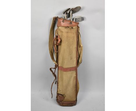 A Set of Vintage Golf Clubs in Canvas Bag 