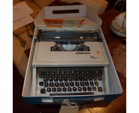 A vintage Olivetti typewriter in original case and another similar  
