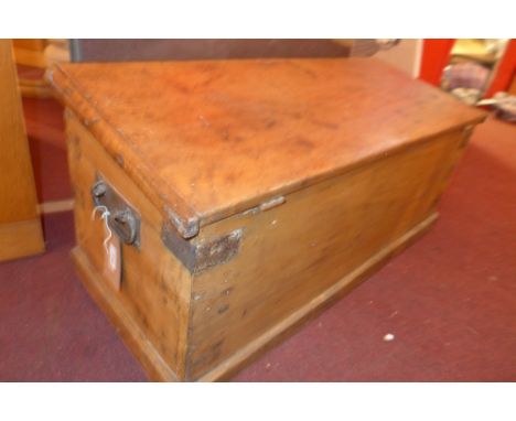 A Victorian pine trunk with iron handles 
