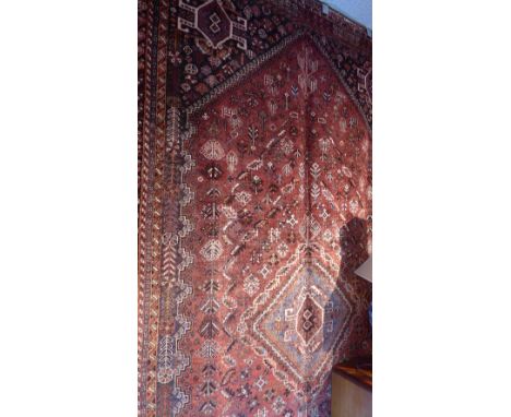 An extremely fine south west Persian Qashgai carpet 270 x 168cm, central diamond medallion with repeating animal and petal mo