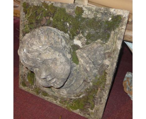 A stoneware sculptural portrait on a square background 