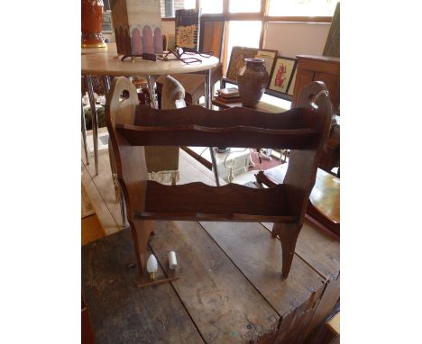 An oak floor standing book trough 