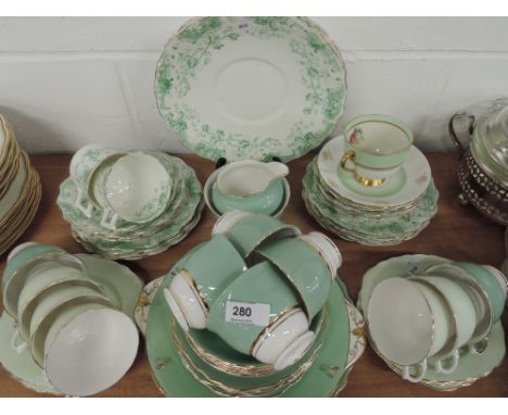A selection of tea cups and saucers with various designs