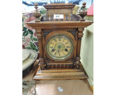 An oak bodied bracket clock with single hand movement