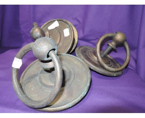 A selection of three large brass cast door handles and back plates