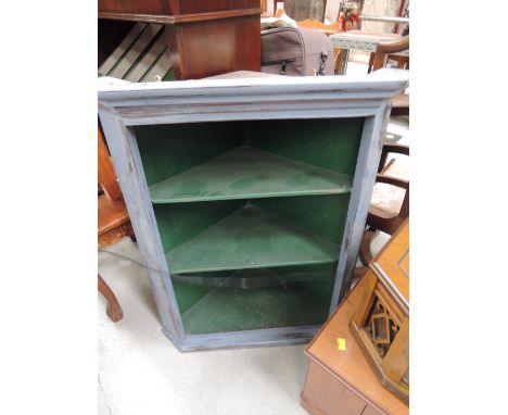 A traditional design grey painted corner shelf cupboard