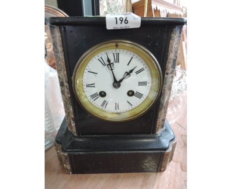 An elegant marble and similar stone cut mantle clock with enamel face plate