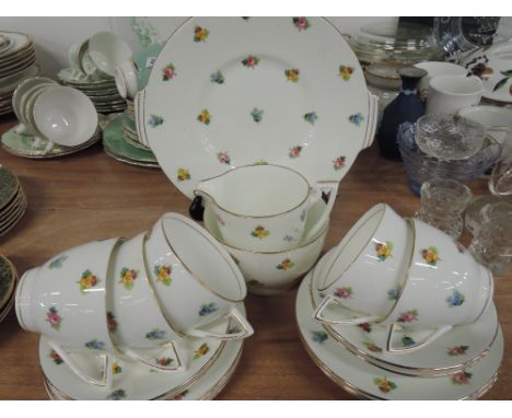 A part tea service by Mintons with brown back stamp