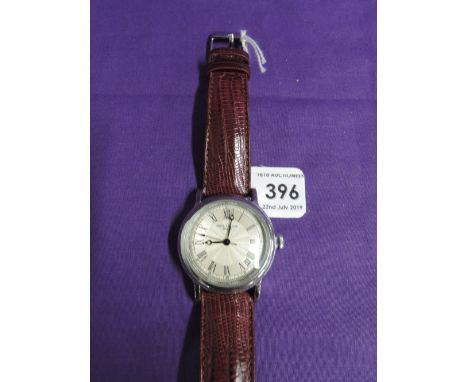 A gents fashion wrist watch bearing the name Patek Philippe having a Roman numeral dial with perimeter minute dial and date a