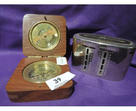 A brass compass and Martins Bank penny saver