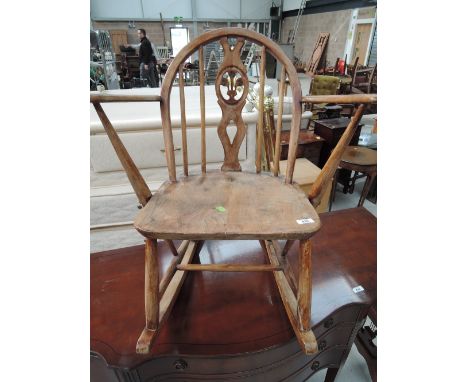 A stripped Ercol style childs rocking chair