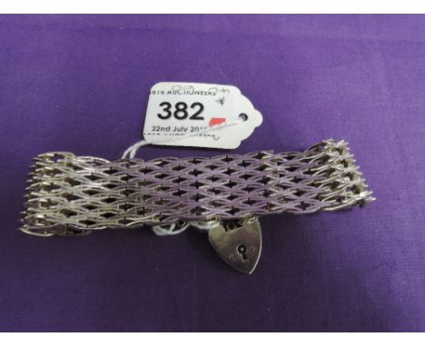 An HM silver five bar stylised gate bracelet with padlock clasp and added safety chain