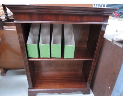 A reproduction mahogany book shelf