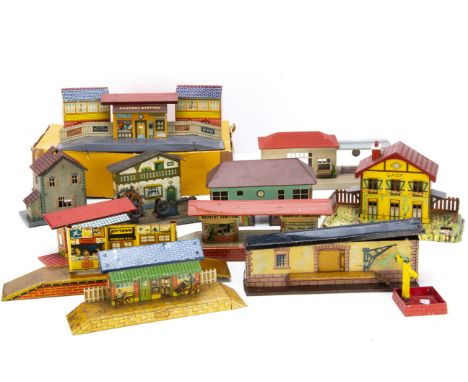 An Assortment of O Gauge tinplate Stations and other Lineside Accessories, including a boxed JEP electrically-operated level 