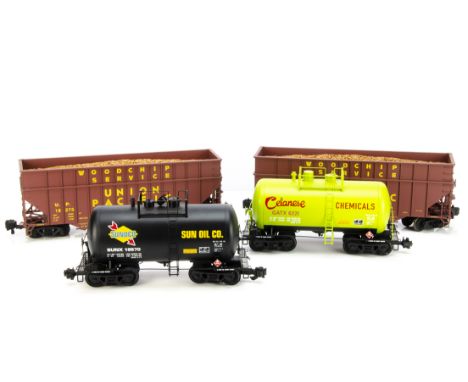 Four Modern Gauge 1 American Freight Wagons, comprising two Korean brass tank wagons by unknown maker, one in Sunoco black li