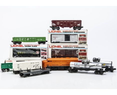 An older American 0 Gauge F-7 Diesel Locomotive by Lionel and various Freight Stock, the locomotive a Bo-Bo in orange 'Union 