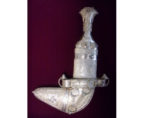 Khanjar Omani dagger, a framed 20th Century Islamic dagger, with extensive silver work and crest inlaid, a spectacular piece 