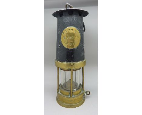 A miner's lamp, marked Davis Miners Lamp