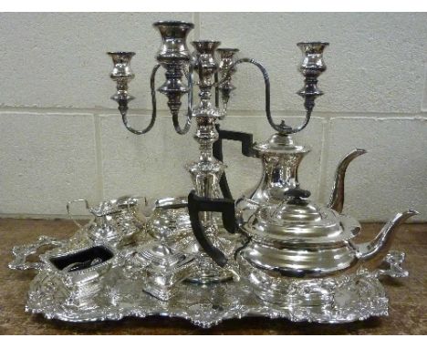 A Viner's four piece plated tea service, a plated tray, a plate on copper four branch candelabra and a cruet set