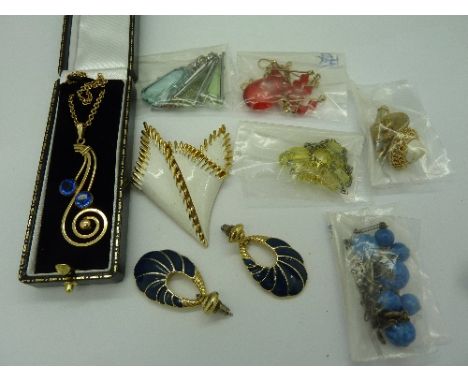 A Simmons pendant, a Trifari brooch and vintage necklaces