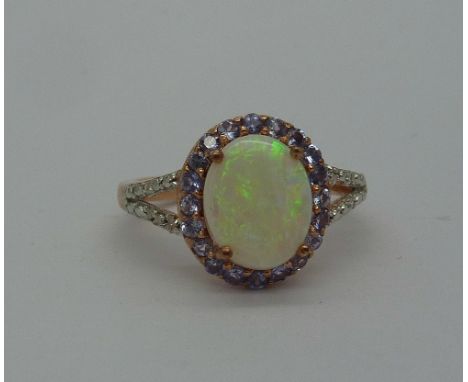 A silver gilt, opal, tanzanite and diamond ring, size O