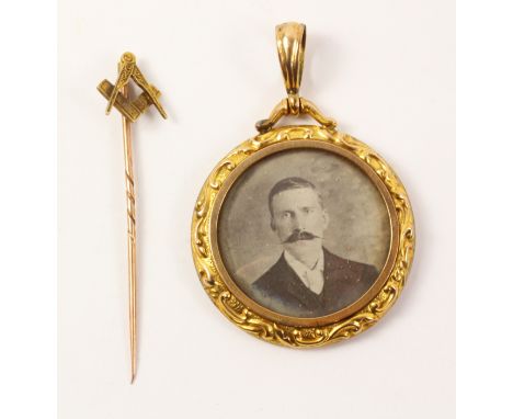 Victorian circular picture locket pendant stamped 9ct and a Masonic stick pin   Condition Report   Click here for further ima