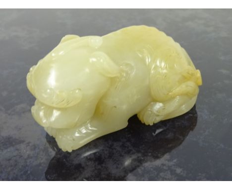 Chinese pale Celadon jade carving of a recumbent lion - dog, L6.5cm   Condition Report  Good condition, on ear feels slightly