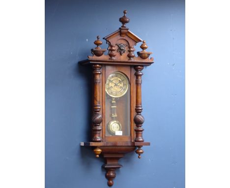 Early 20th century walnut Vienna clock, metal dial, with half column pilasters, twin train chiming movement striking the half