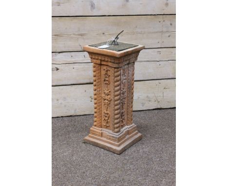 Brass sundial on square terracotta pedestal with moulded decoration and twist corners, H58cm   Condition Report   Click here 
