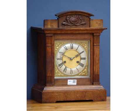 20th century architectural oak cased mantle clock, silvered chapter, twin train HAC movement striking the half hours on a coi