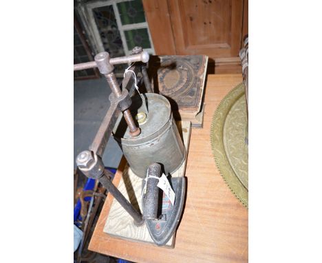 An old family Bible with leather cover and brass bindings (badly distressed); a vintage tongue press; and an old flat iron, i
