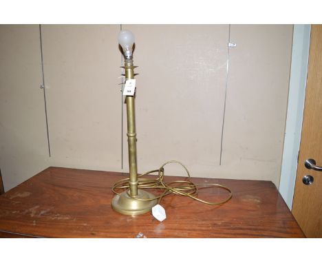 A brass table lamp.