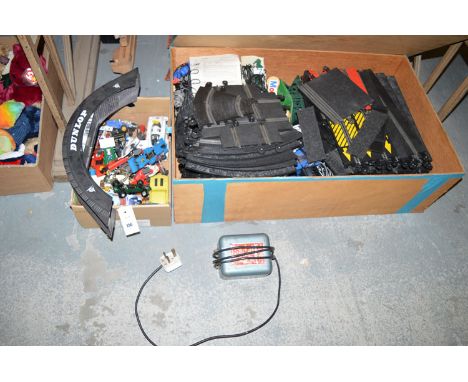 A large quantity of Scalextric track and accessories, in rectangular wooden box; together with a box of Scalextric model raci