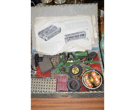 A box of vintage Meccano parts.