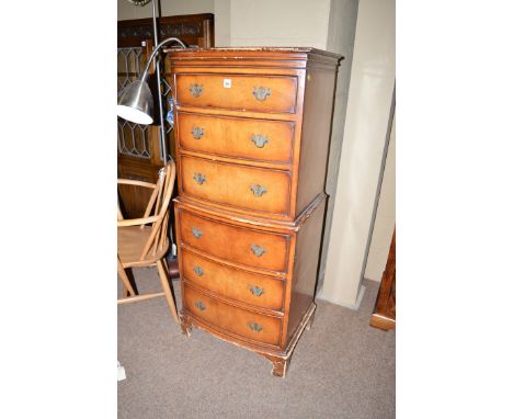 A reproduction miniature walnut bowfront chest-on-chest, fitted three drawers in the top section and three drawers in the bot