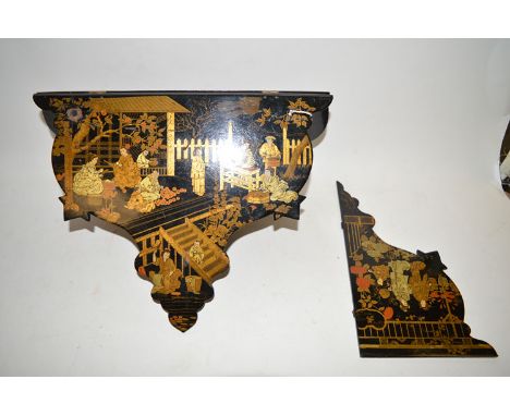 A Japanese black lacquered folding wall bracket, decorated typical Japanese scenes of figures in gardens.