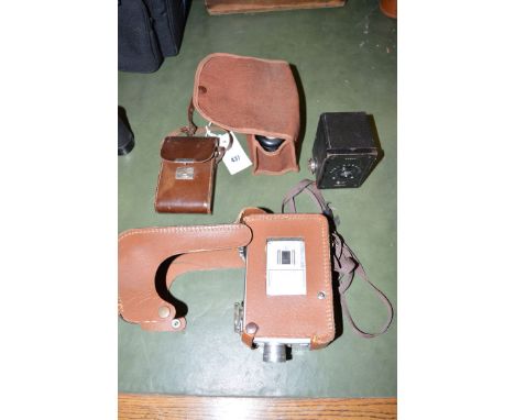 A Kodak Brownie 8mm movie camera; three cameras including a Kodak 'Baby Hawkeye' boxed camera.