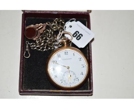 A gilt cased Garrard pocket watch with roman white enamel dial and subsidiary seconds aperture, engraved to reverse, on a sil